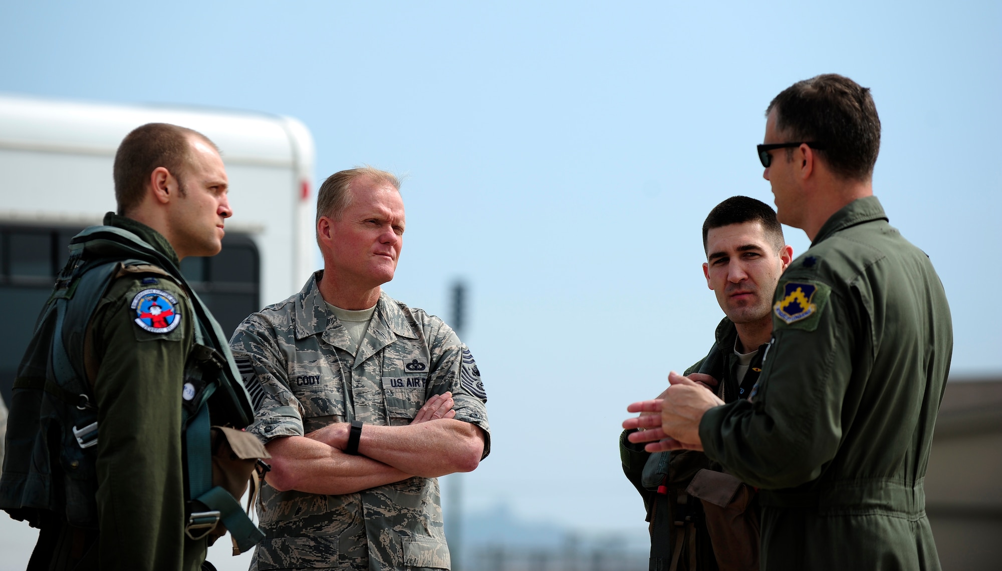 Chief Master Sgt. of the Air Force James A. Cody discusses flying operations with F-16 Fighting Falcon pilots from the 35th Fighter Squadron during a tour at Kunsan Air Base, Republic of Korea, July 2, 2015. Cody engaged with Wolf Pack Airmen to answer questions and give insight on key Air Force topics and changes. (U.S. Air Force photo by Staff Sgt. Nick Wilson/Released)