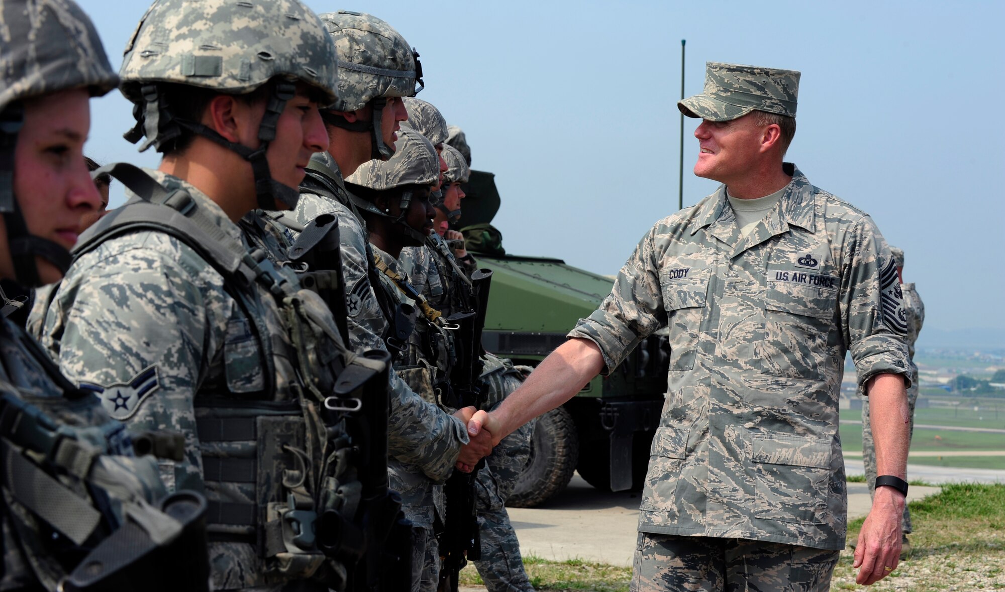 Chief Master Sgt. of the Air Force James A. Cody meets defenders from the 8th Security Forces Squadron during an immersion tour at Kunsan Air Base, Republic of Korea, July 2, 2015. Cody engaged with Wolf Pack Airmen to answer questions and give insight on key Air Force topics and changes. (U.S. Air Force photo by Staff Sgt. Nick Wilson/Released)