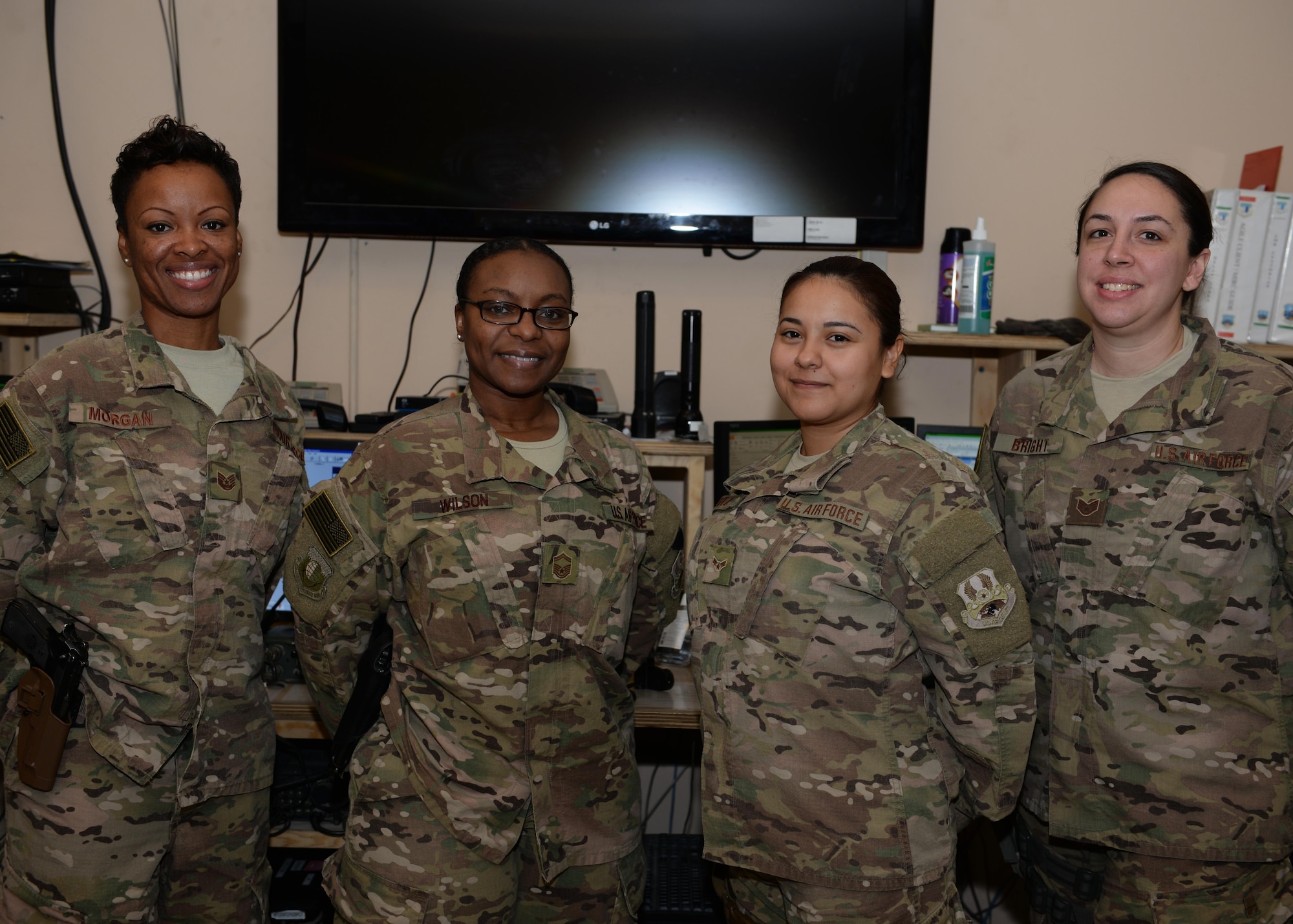 Part of the U.S. Airmen assigned to the 455th Air Expeditionary Wing Command Post, pose for a photo July 6, 2015, at Bagram Airfield, Afghanistan. The small team of Airmen is responsible for initiating wing recalls, relaying weather and inbound attack notifications to the base as well as work with aircrews and other various agencies in keeping the base abreast on important information. (U.S. Air Force photo by Senior Airman Cierra Presentado/Released)