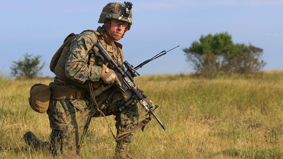 Staff Sgt. Dale Elbert, platoon sergeant with Golf Company, Black Sea Rotational Force and native of St. Louis, Mo., awaits the start of the U.S. and Romanian platoon attacks at Babadag Training Area, July 2.  This week-long engagement is part of a continuous military skills series between BSRF and the Romanian 307th Naval Infantry.