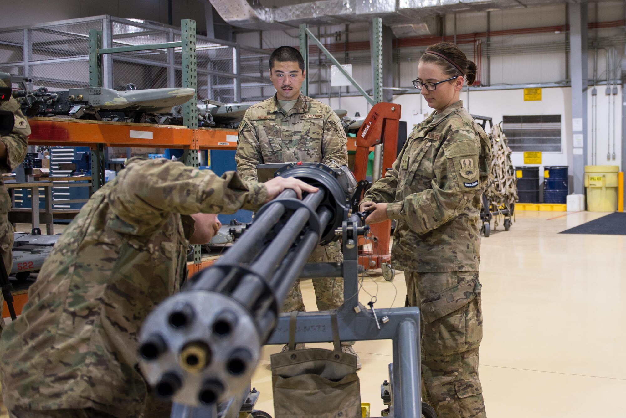 U.S. Airmen assigned to the 455th Expeditionary Maintenance Squadron Armament Flight perform an inspection on an F-16 Fighting Falcon 20mm Gatlin gun at Bagram Airfield, Afghanistan, July 5, 2015. The Gatling gun system is a fixed-forward firing system that provides maximum lethality against air-to-air and air-to-surface targets. (U.S. Air Force photo by Tech. Sgt. Joseph Swafford/Released)