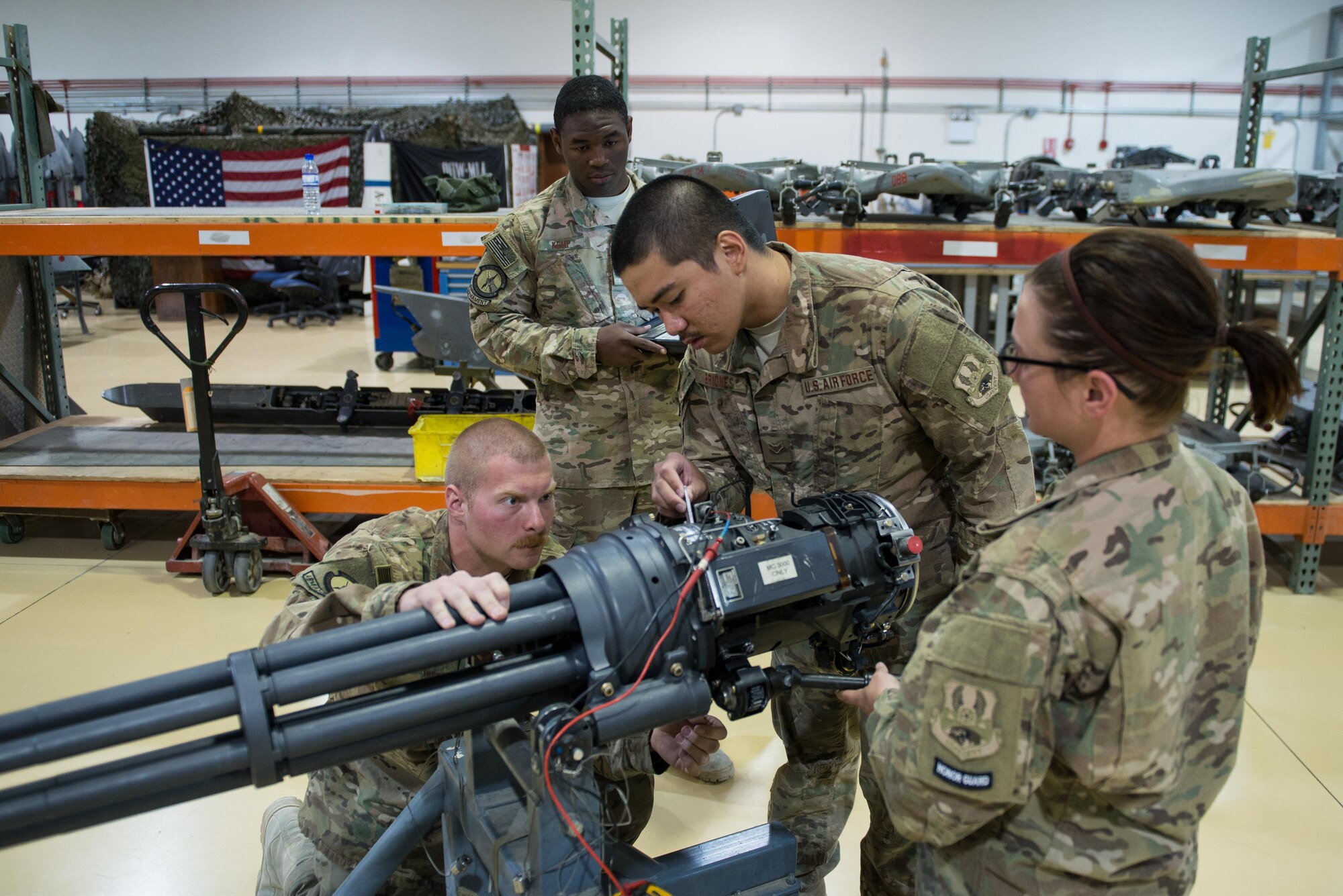 U.S. Airmen assigned to the 455th Expeditionary Maintenance Squadron Armament Flight perform an inspection on an F-16 Fighting Falcon 20mm Gatlin gun at Bagram Airfield, Afghanistan, July 5, 2015. The Gatling gun system is a fixed-forward firing system that provides maximum lethality against air-to-air and air-to-surface targets. (U.S. Air Force photo by Tech. Sgt. Joseph Swafford/Released)
