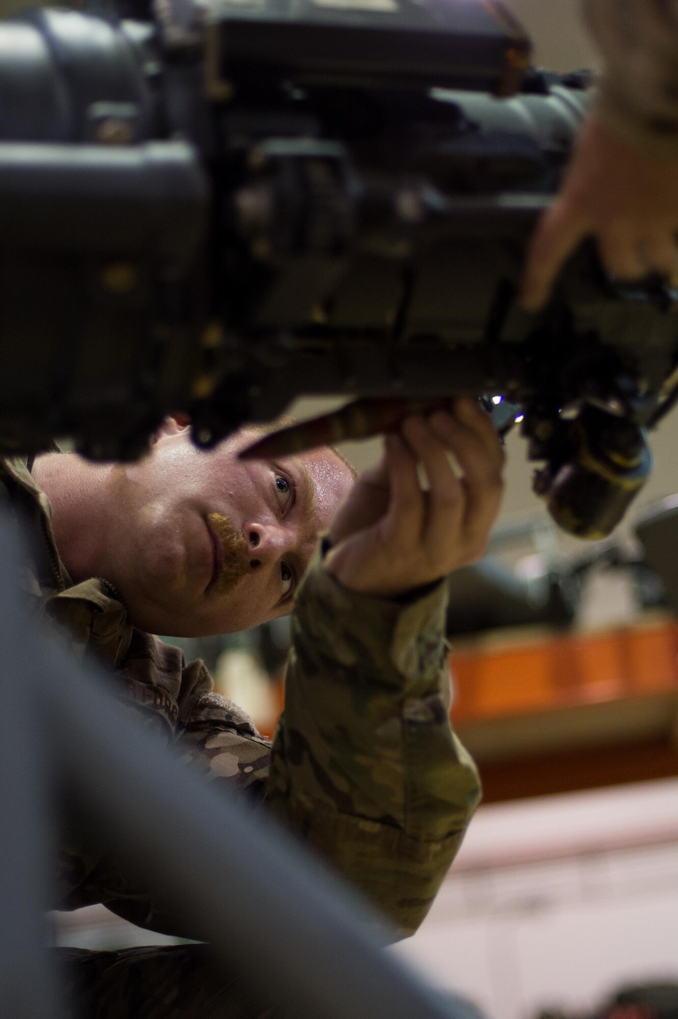 U.S. Air Force Staff Sgt. Max Kirschner, 455th Expeditionary Maintenance Squadron Armament Flight, performs an inspection on an F-16 Fighting Falcon 20mm Gatlin gun at Bagram Airfield, Afghanistan, July 5, 2015. The Gatling gun system is a fixed-forward firing system that provides maximum lethality against air-to-air and air-to-surface targets. (U.S. Air Force photo by Tech. Sgt. Joseph Swafford/Released)