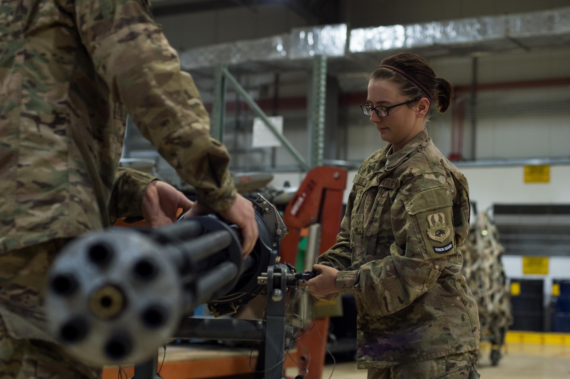 U.S. Air Force Airman 1st Class Tiffany Leese, 455th Expeditionary Maintenance Squadron Armament Flight, performs an inspection on an F-16 Fighting Falcon 20mm Gatlin gun at Bagram Airfield, Afghanistan, July 5, 2015. The Gatling gun system is a fixed-forward firing system that provides maximum lethality against air-to-air and air-to-surface targets. (U.S. Air Force photo by Tech. Sgt. Joseph Swafford/Released)