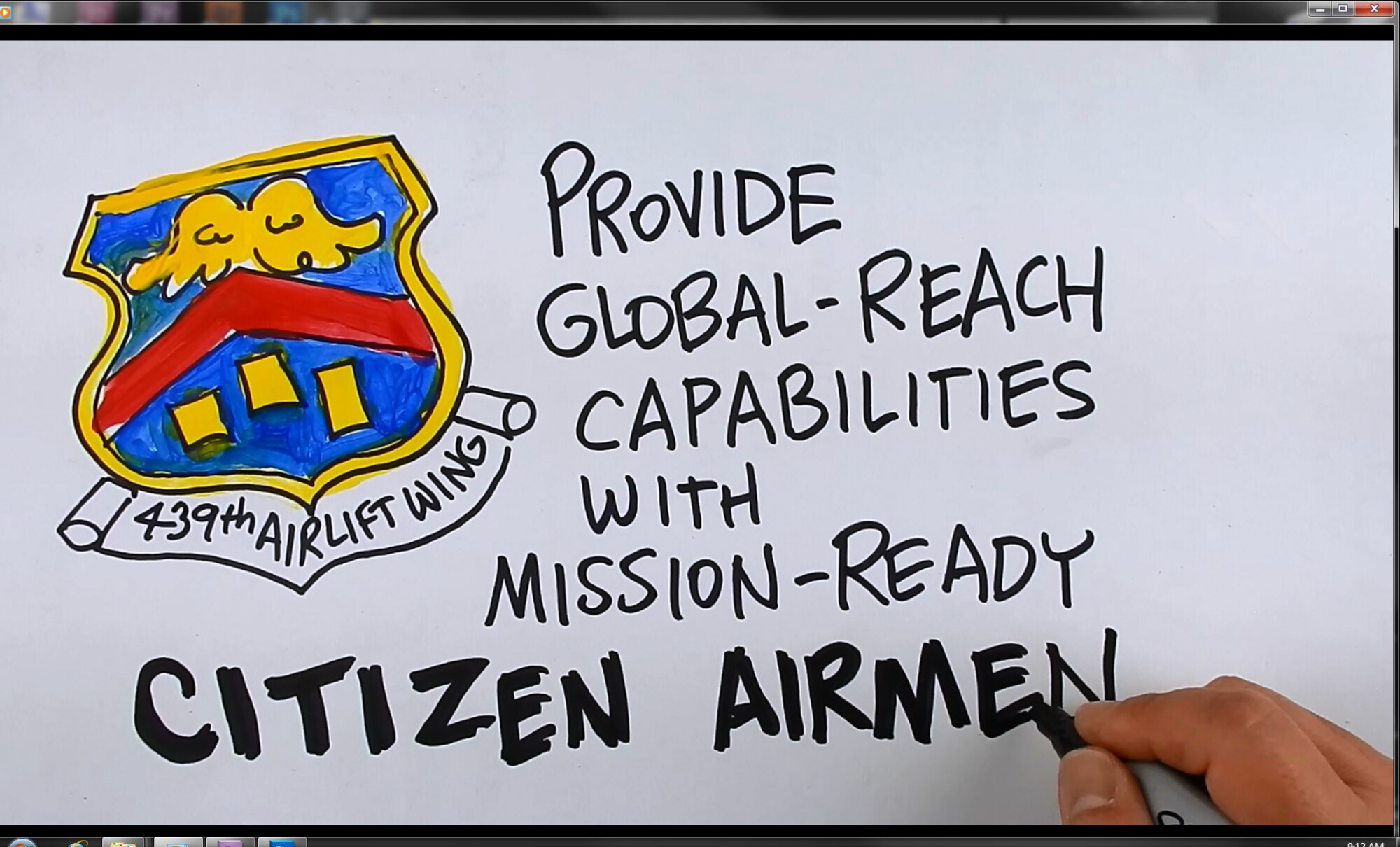 A screenshot of Air Force Reserve cartoonist, W.C. Pope, drawing in an informative video about the new Air Force inspection system.
