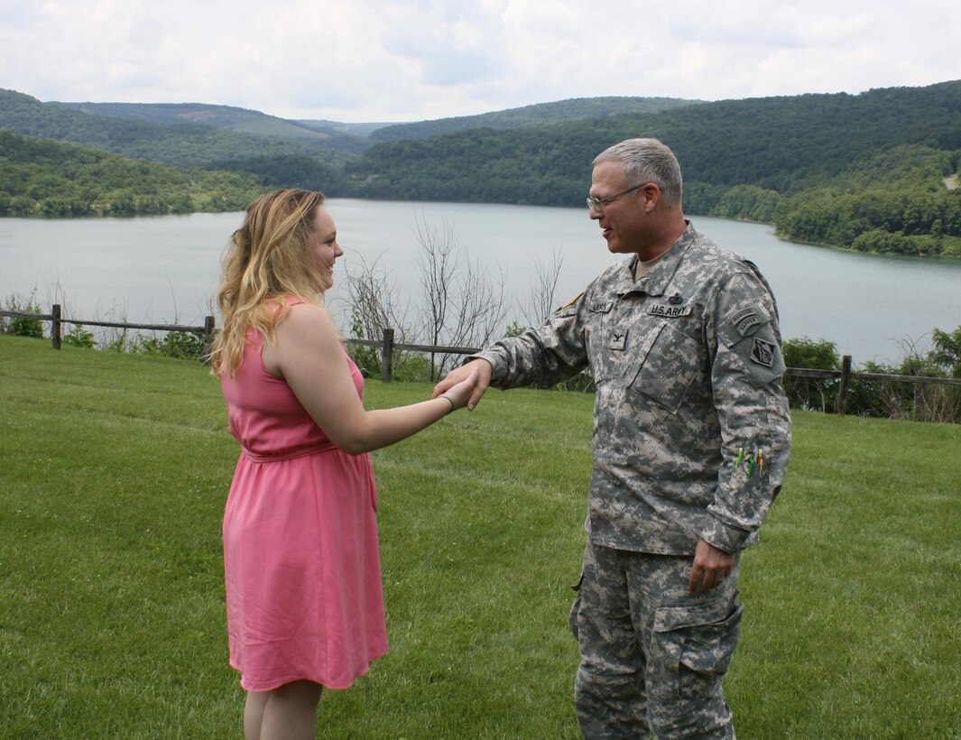 Col. Trey Jordan (right) gives Karli Hakala (left), a Baltimore District coin for being honored as one of 9 students nationally to receive  the Army Engineer Memorial award.