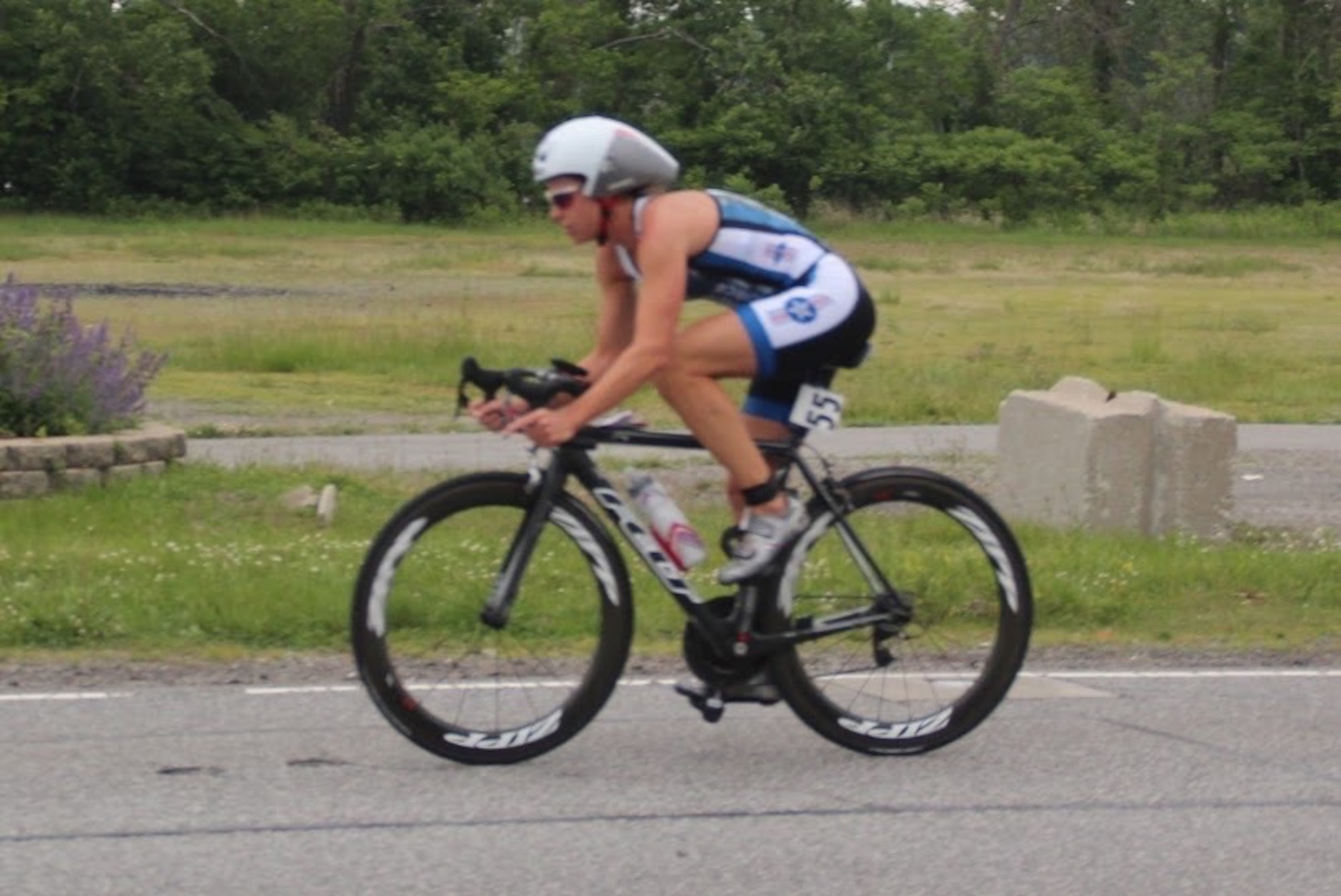 Maj. Jamie Turner bikes during the Armed Forces Triathlon Championship race in Hammond, Indiana, June 7, 2015. Turner continued her world-class triathlete success as the second female to cross the finish line and automatically qualified as one of six athletes to compete on the women’s team at the Military World Games in Mungyeong, South Korea, Oct. 2-11, 2015. Turner is a C-17 pilot with the 317th Airlift Squadron. (Courtesy photo)