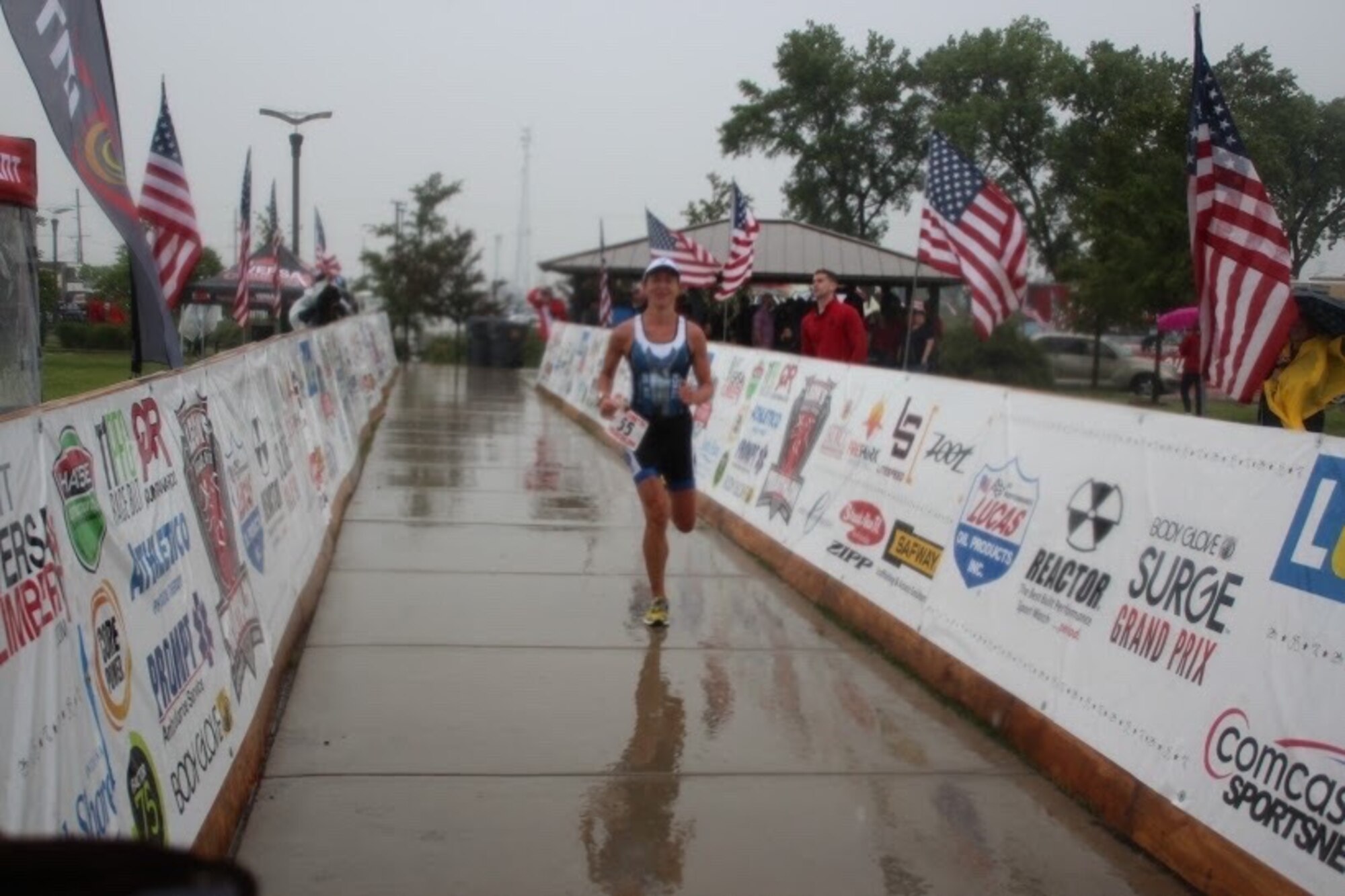 Maj. Jamie Turner runs toward the finish line during the Armed Forces Triathlon Championship race in Hammond, Indiana, June 7, 2015. Turner continued her world-class triathlete success as the second female to cross the finish line and automatically qualified as one of six athletes to compete on the women’s team at the Military World Games in Mungyeong, South Korea, Oct. 2-11, 2015. Turner is a C-17 pilot with the 317th Airlift Squadron. (Courtesy photo)