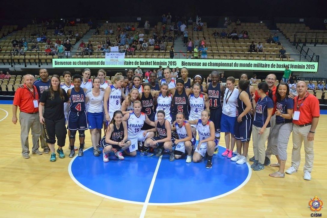 Team USA and Team France together after the bronze medal game against France.  USA defeats France 78-41 during the 1st Conseil International du Sport Militaire (CISM) World Women's Basketball Championship in Angers, France June 28 to July 5.  