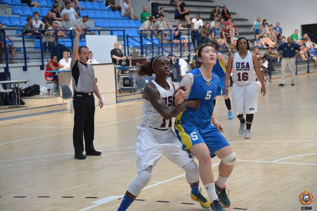 Army Sgt. Kimberly Smith of Fort Riley, Kan. defends the paint against China during the 1st Conseil International du Sport Militaire (CISM) World Women's Basketball Championship in Angers, France June 28 to July 5.  