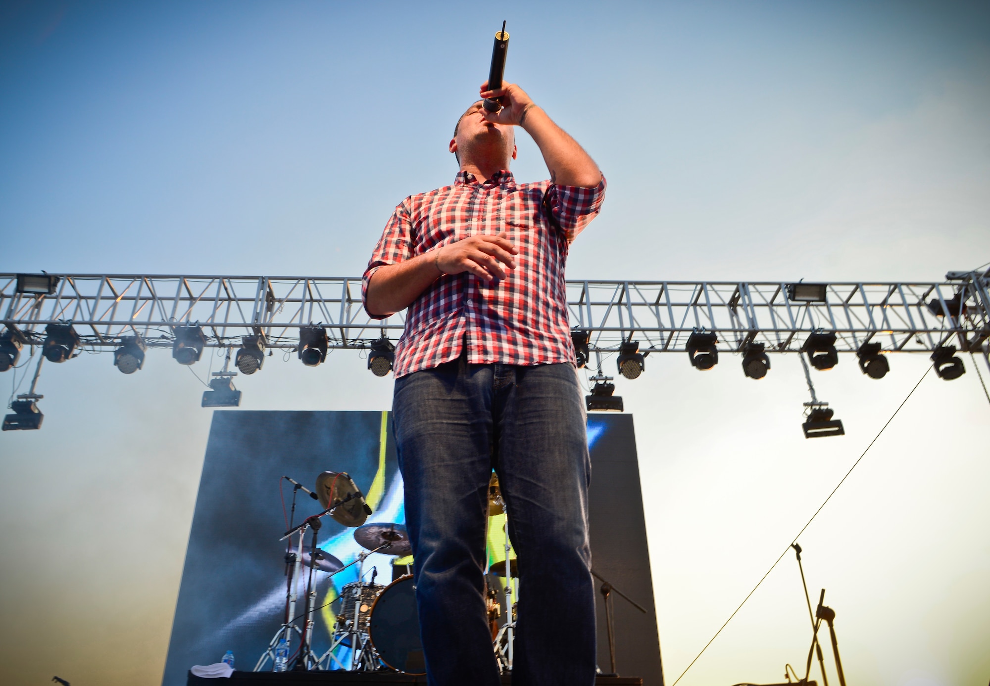 Dryden Mitchell, Alien Ant Farm frontman, sings one of his hit singles, “Attitude,” during an 80-minute concert July 4, 2015 at Osan Air Base, Republic of Korea. Alien Ant Farm was at Osan AB in part of the Liberty Fest entertainment, in celebration of Independence Day. (U.S. Air Force photo/Tech. Sgt. Travis Edwards) 