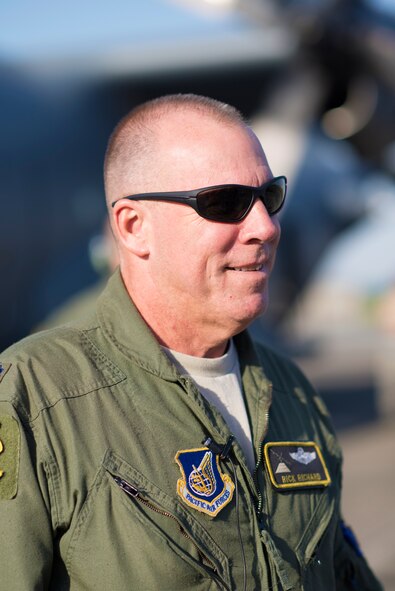 Lt. Col. Rick Richard stands in front of a C-130 Hercules a t Yokota Air Base, Japan, May 5, 2015. Richard, along with Airmen throughout Yokota representing a variety of career specialties, left to support the Government of Nepal after a 7.8 magnitude earthquake struck the country April 25. (U.S. Air Force photo by Airman 1st Class Delano Scott/Released)