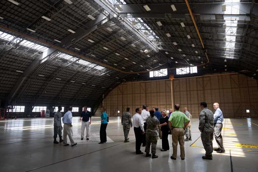 Site Activation Task Force members visit a hangar on Yokota Air Base, Japan, June 22, 2015. The team was comprised of subject matter experts from Pacific Air Forces, headquartered at Joint Base Pearl Harbor-Hickam, Hawaii. (U.S. Air Force photo by Airman 1st Class Delano Scott/Released)