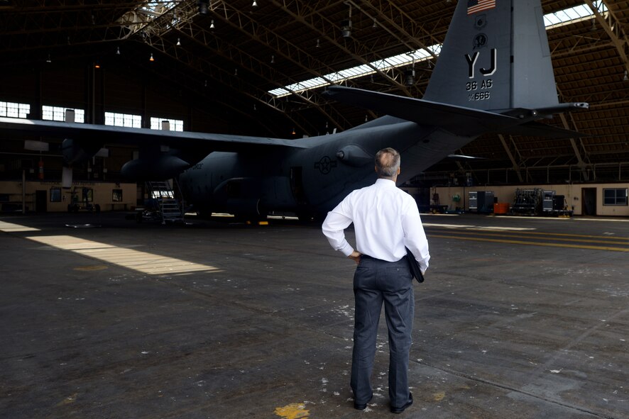 A Site Activation Task Force team member visits a C-130 Hercules hangar, June 22, 2015, at Yokota Air Base, Japan. The SATAF team spent five days with their wing counterparts to better understand processes, supplies and different requirements between the current C-130H model and the C-130J model. (U.S. Air Force photo by Airman 1st Class Delano Scott/Released)