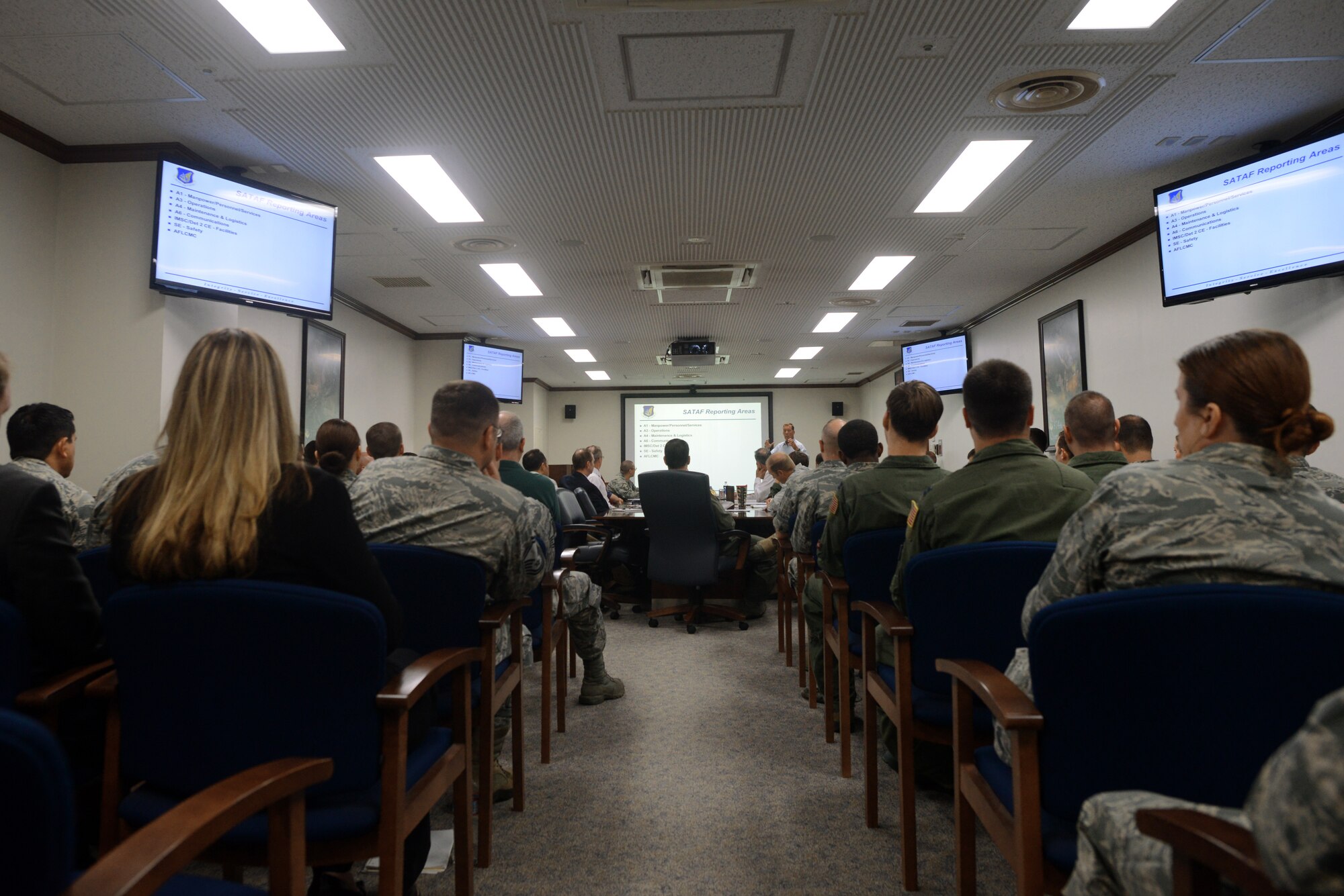 Members of a Site Activation Task Force team brief Yokota leadership, June 22, 2015, at Yokota Air Base, Japan. The SATAF visited Yokota to help plan the integration of the C-130J Super Hercules, the newest iteration of the C-130. (U.S. Air Force photo by Airman 1st Class Delano Scott/Released)