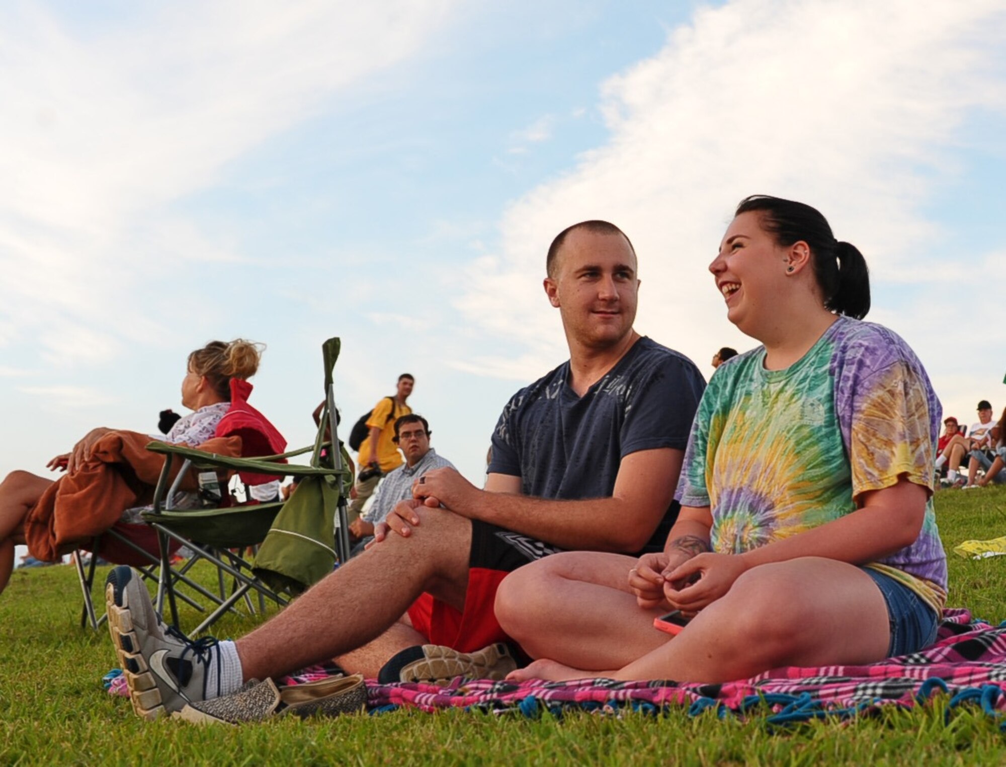 Airman 1st Class Kaleb Grant, 14th Force Support Squadron, and his wife, Amber Grant, enjoy the music and their view at the Fireworks on the Water event July 4. Attendees got a chance to watch the performance of Johnny Coleman and Swing Shift, a local Mississippi band. (U.S. Air Force photo/Airman 1st Class John Day)