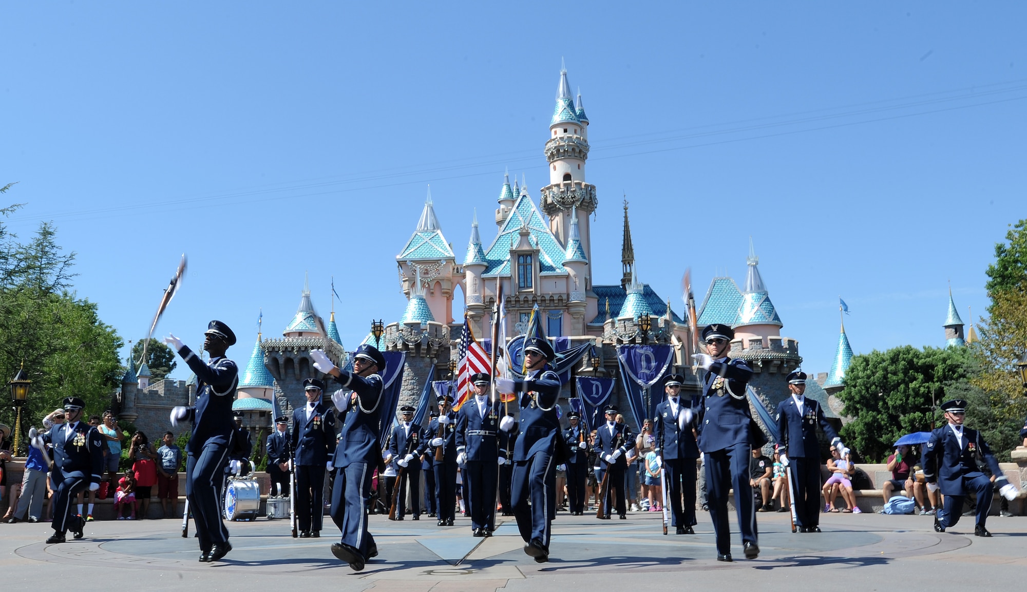 The United States Air Force Honor Guard performs at Disneyland in Anaheim, Calif., July 2, 2015. During the Fourth of July weekend each year, Disneyland invites military units to the park for special performances, a tradition started by Walt Disney on opening day. (U.S. Air Force photo/Staff Sgt. Nichelle Anderson)