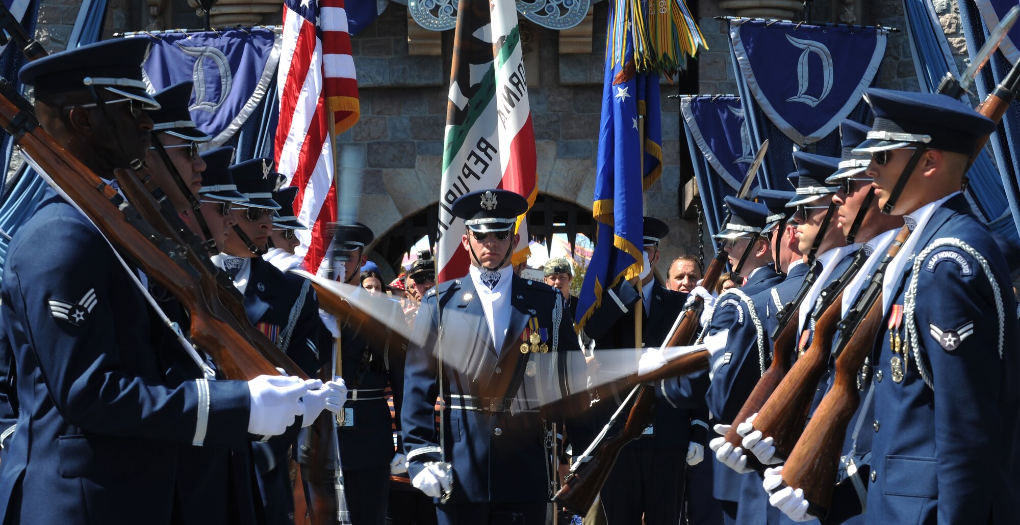 The United States Air Force Honor Guard performs in front of the Disney castle at Disneyland Resort in Anaheim, Calif., July 2, 2015. The Honor Guard is participating in several performances daily throughout the Fourth of July weekend. (U.S. Air Force photo/Staff Sgt. Nichelle Anderson)