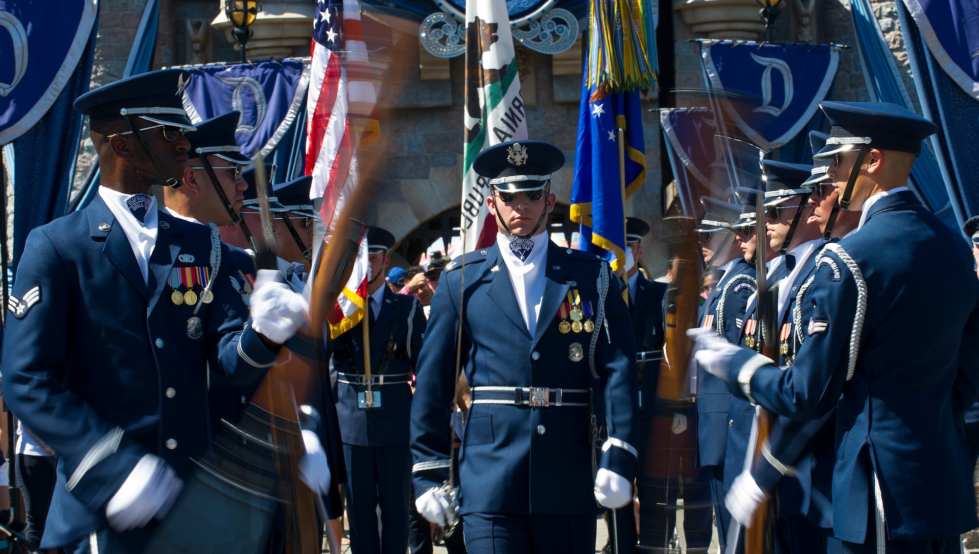 The United States Air Force Honor Guard performs in front of the Disney castle at Disneyland Resort in Anaheim, Calif., July 2, 2015. The Honor Guard is participating in several performances daily throughout the Fourth of July weekend. (U.S. Air Force photo/Staff Sgt. Nichelle Anderson)