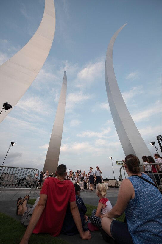 Spectators sit back and listen to the U.S. Air Force Band’s Airmen of Note during a concert at the U.S. Air Force Memorial in Arlington, Va., before the fireworks celebration in Washington, D.C., July 4, 2015. The concert at the U.S. Air Force Memorial is an annual event that ends just before fireworks begin. (U.S. Air Force photo/Airman 1st Class Philip Bryant)