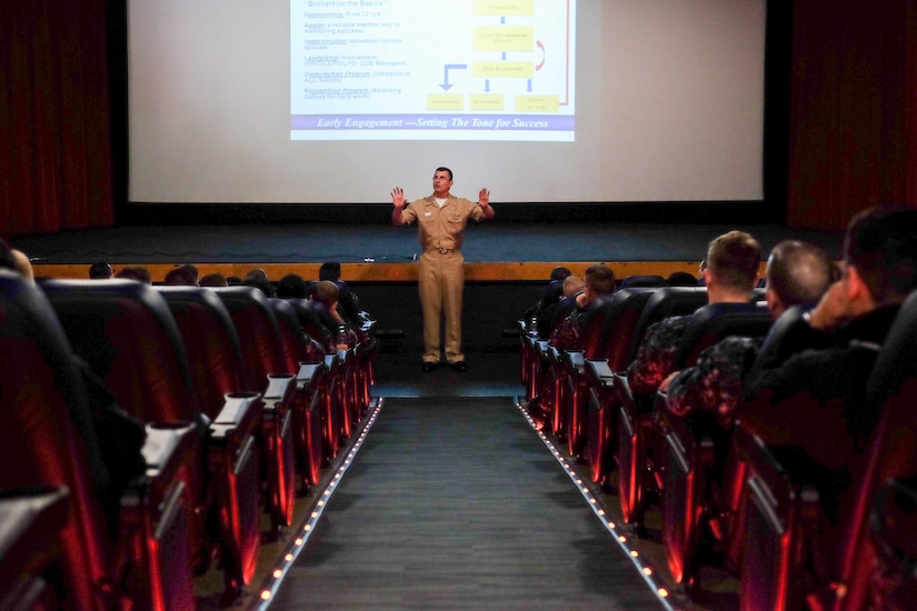 Capt. Bruce Deshotel, from New Orleans, head enlisted community manager, speaks to Sailors during a Navy Personnel Command's Fleet Engagement Team visit in March 2015. The FET spoke about career management system-interactive detailing, limited directed detailing, chief petty officer early return to sea, voluntary sea duty program, billet-based distribution, and other topics related to a Sailors career. (U.S. Navy photo by Mass Communication Specialist 3rd Class Seth Coulter/Released) 
