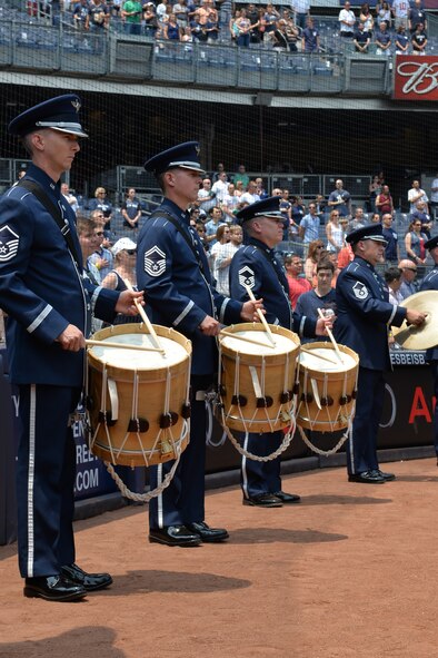Members of the Ceremonial Brass’ drum line perform the National Anthem at Yankee Stadium before the game on July 5, 2015. This performance was part of a larger five-day tour in New York City to represent the Air Force on the nation's birthday (U.S. Air Force photo/1Lt. Esther Willett).