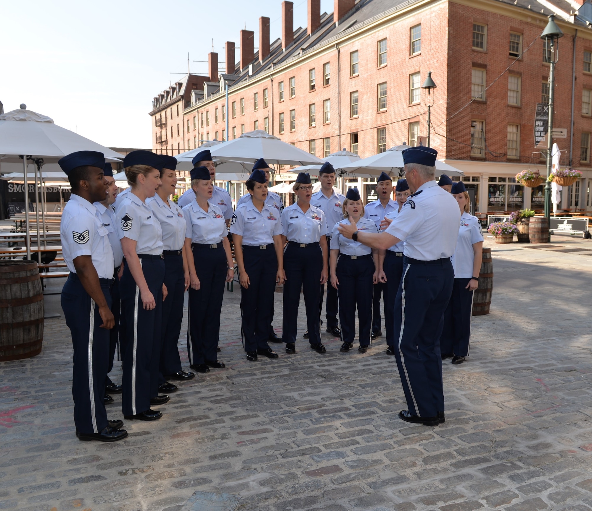 The Singing Sergeants, led by conductor Col. Larry Lang, perform for Fox 5’s “Good Day New York” show at the New York Seaport on July 3, 2015. This performance was part of a larger five-day tour in New York City to represent the Air Force on the nation's birthday (U.S. Air Force photo/1Lt. Esther Willett).