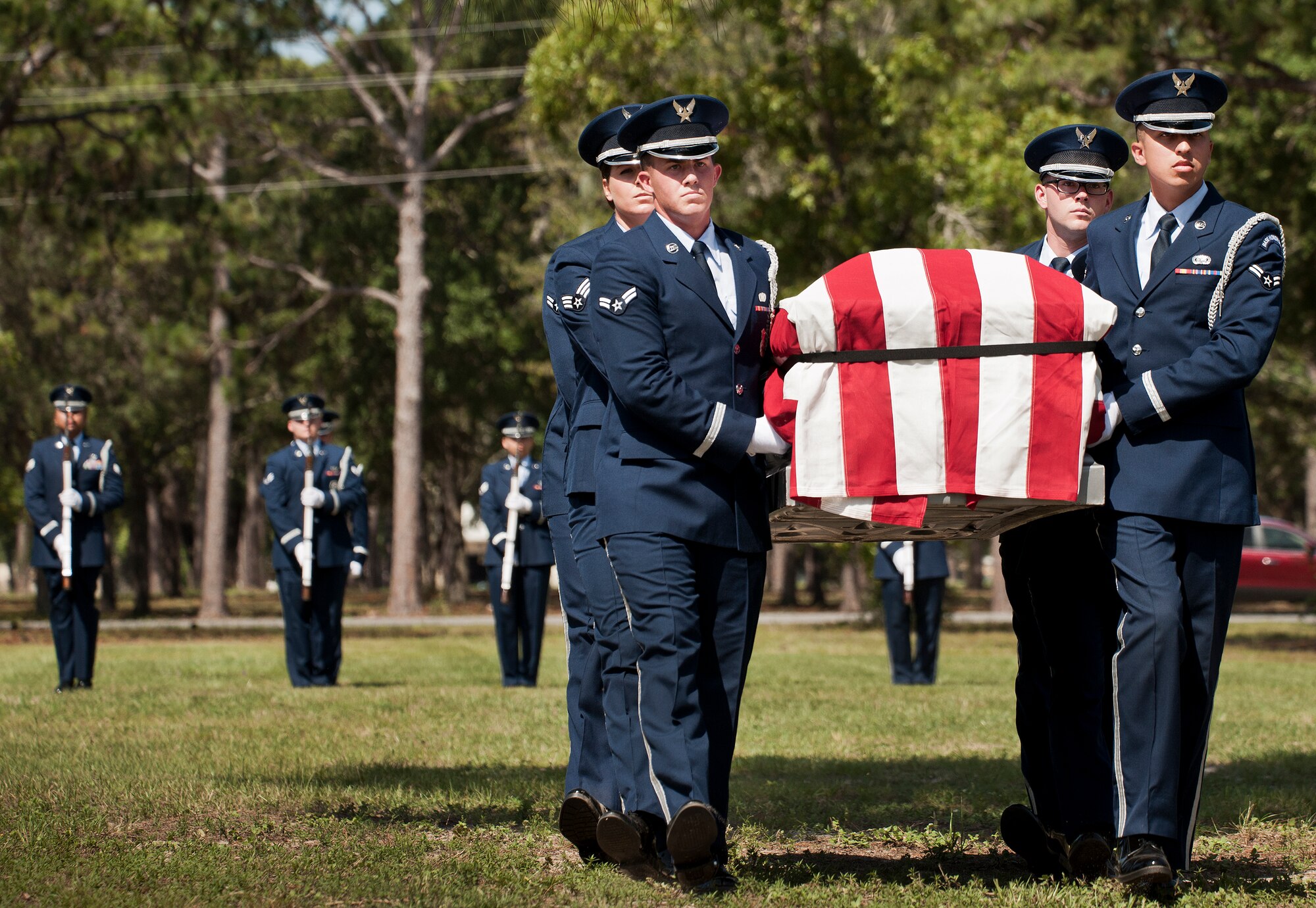 Members of the Eglin Air Force Base Honor Guard carry a casket during the unit’s graduation ceremony June 15. Approximately 12 new Airmen graduated from the 80-plus-hour course. The graduation performance includes flag detail, rifle volley, pall bearers and bugler for friends, family and unit commanders. (U.S. Air Force photo/Samuel King Jr.)