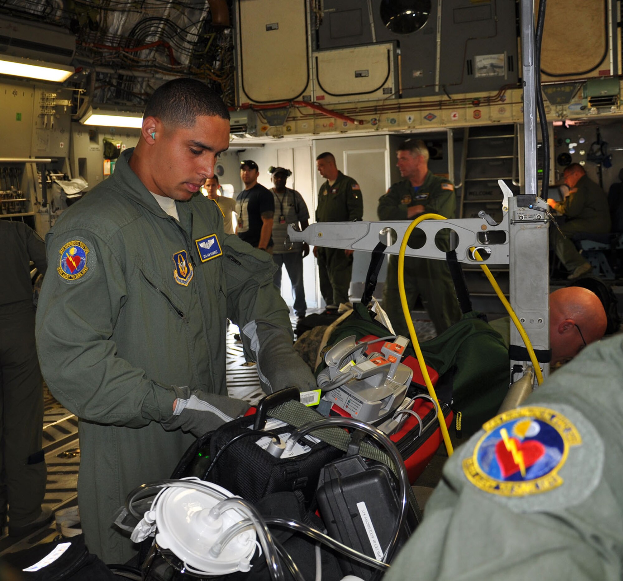 WRIGHT-PATTERSON AIR FORCE BASE, Ohio - Senior Airman Ian Ramirez, an aeromedical evacuation technician assigned to the 445th Aeromedical Evacuation Squadron, prepares for a training mission on board a 445th Airlift Wing C-17 Globemaster III May 29, 2015. (U.S. Air Force photo/Master Sgt. Carie Brown)