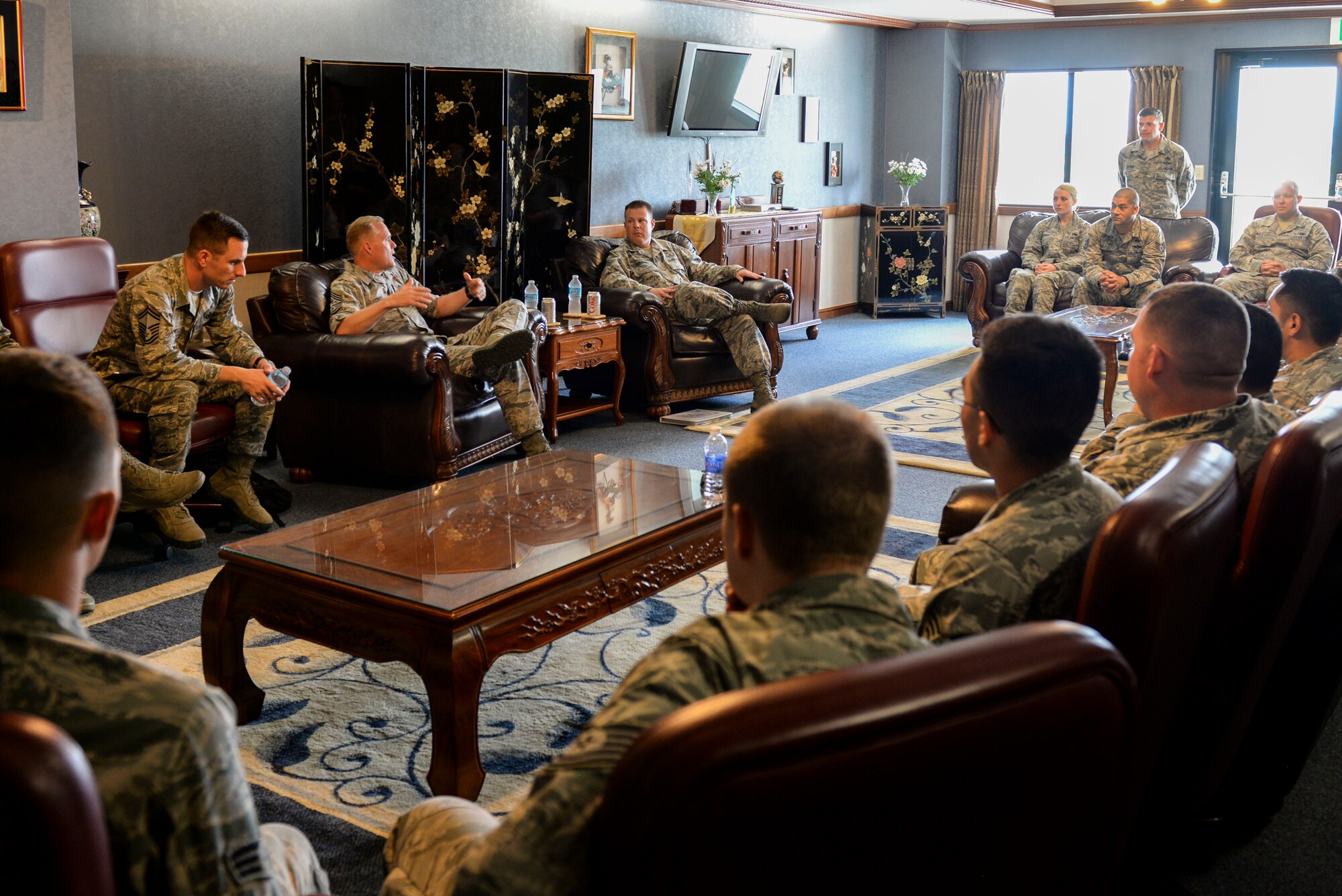 Chief Master Sgt. of the Air Force James Cody sits down with Airmen from the 733rd Air Mobility Squadron on Kadena Air Base, Japan, July 6, 2015. Cody address challenges and opportunities facing today’s Airmen, such as possible changes to retirement, Senior NCO boards and the recent changes to the Enlisted Evaluation System. (U.S. Air Force photo by Senior Airman Omari Bernard)