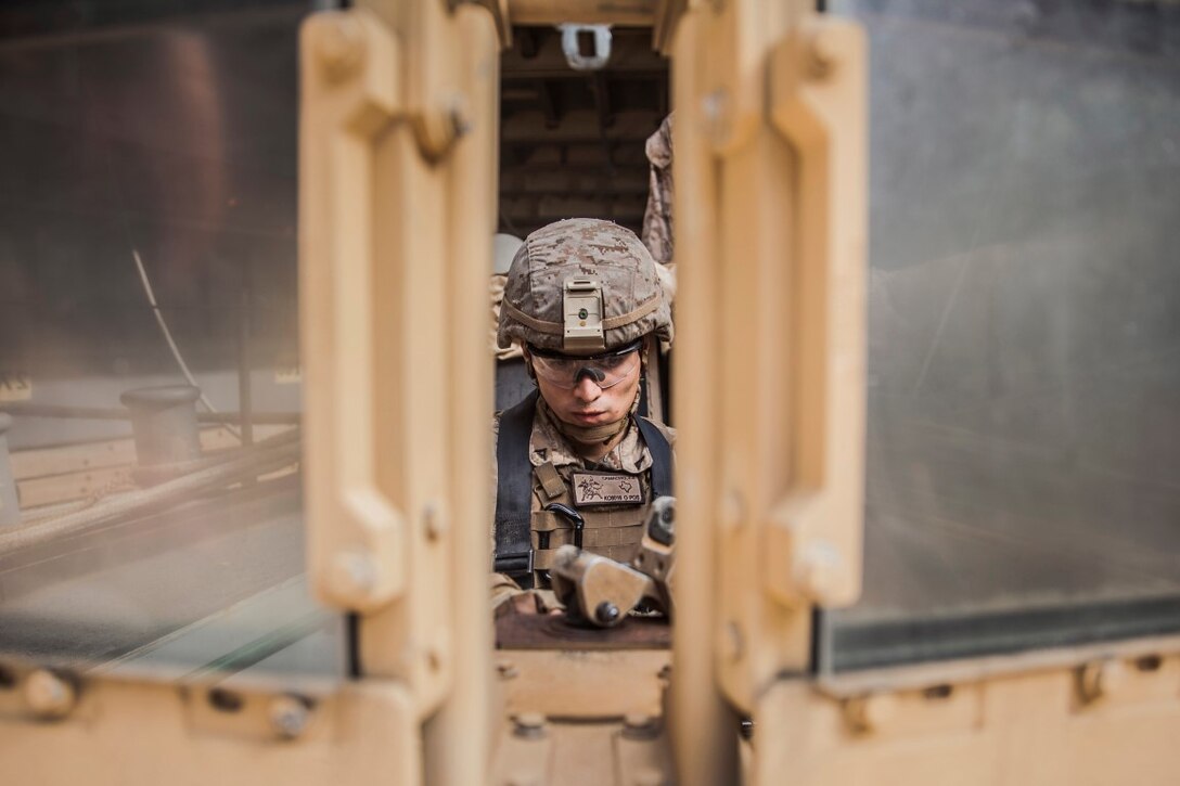 U.S. Marine Lance Cpl. Jamie Camacho mounts an M240B machine gun to the turret of a Humvee during mounted-weapons drills aboard the dock landing ship USS Rushmore (LSD 47). Camacho is an automatic rifleman with Kilo Company, Battalion Landing Team 3rd Battalion, 1st Marine Regiment, 15th Marine Expeditionary Unit. During the training, Marines rehearsed mounting and dismounting the M240B, reload drills, and engaging multiple targets. The 15th MEU is embarked on the Essex Amphibious Ready Group and deployed to maintain regional security in the U.S. 5th Fleet area of operations. (U.S. Marine Corps photo by Sgt. Emmanuel Ramos/Released)