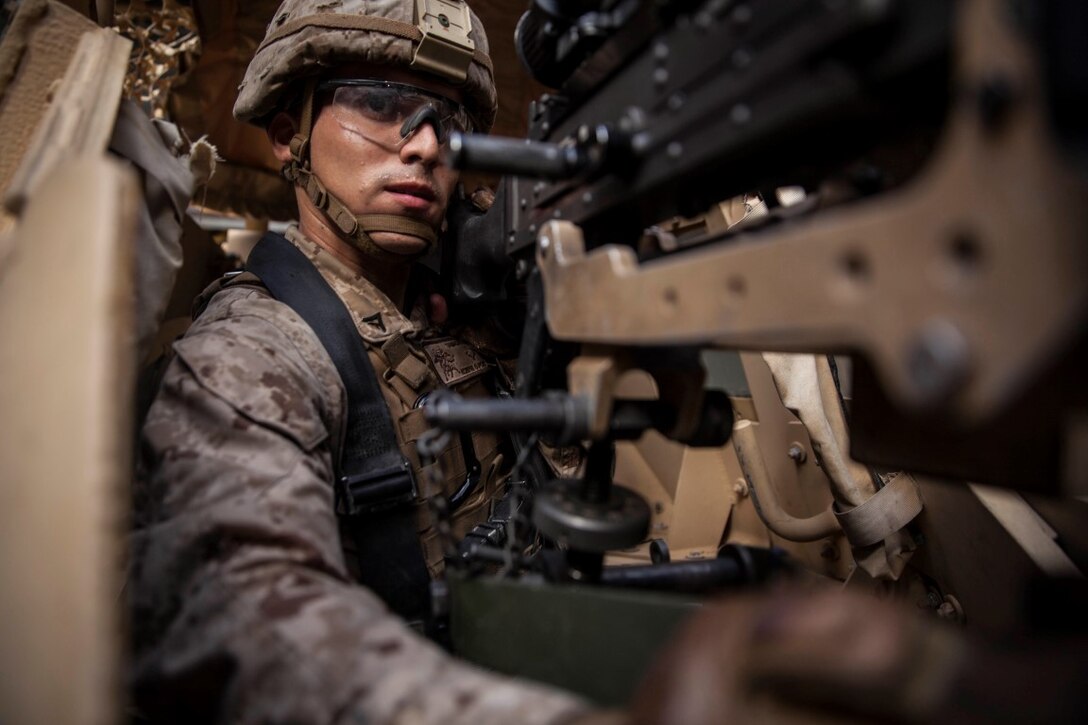 U.S. Marine Lance Cpl. Jamie Camacho mounts an M240B machine gun to the turret of a Humvee during mounted-weapons drills aboard the dock landing ship USS Rushmore (LSD 47). Camacho is an automatic rifleman with Kilo Company, Battalion Landing Team 3rd Battalion, 1st Marine Regiment, 15th Marine Expeditionary Unit. During the training, Marines rehearsed mounting and dismounting the M240B, reload drills, and engaging multiple targets. The 15th MEU is embarked on the Essex Amphibious Ready Group and deployed to maintain regional security in the U.S. 5th Fleet area of operations. (U.S. Marine Corps photo by Sgt. Emmanuel Ramos/Released)