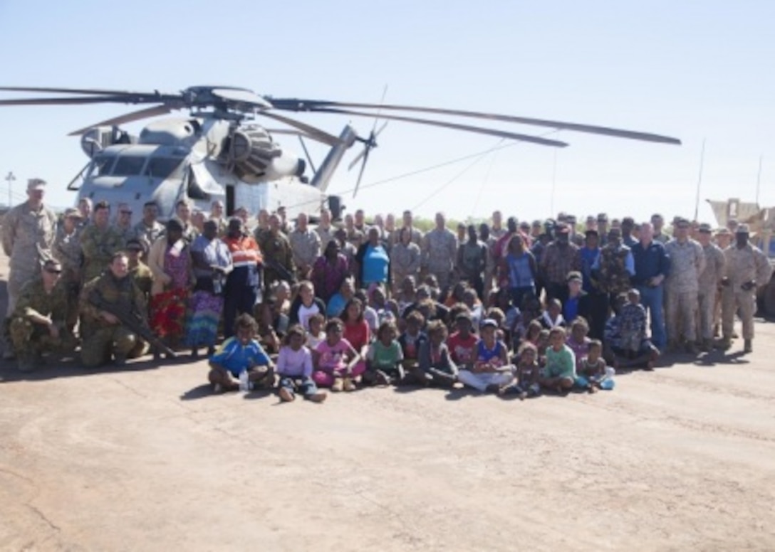 The local and traditional land owners of Bradshaw, U.S. Marines, U.S. Navy sailors and Australian soldiers pose for a group photo June 23 after the “Welcome to Country” ceremony at Bradshaw Training Area, Northern Territory, Australia. The ceremony took place in conjunction with a static display before Exercise Koolendong at BFTA. Marine Rotational Force – Darwin highlights excellent opportunities to improve our knowledge of our allies’ customs and traditions which ultimately strengthens U.S.-Australian military interoperability.