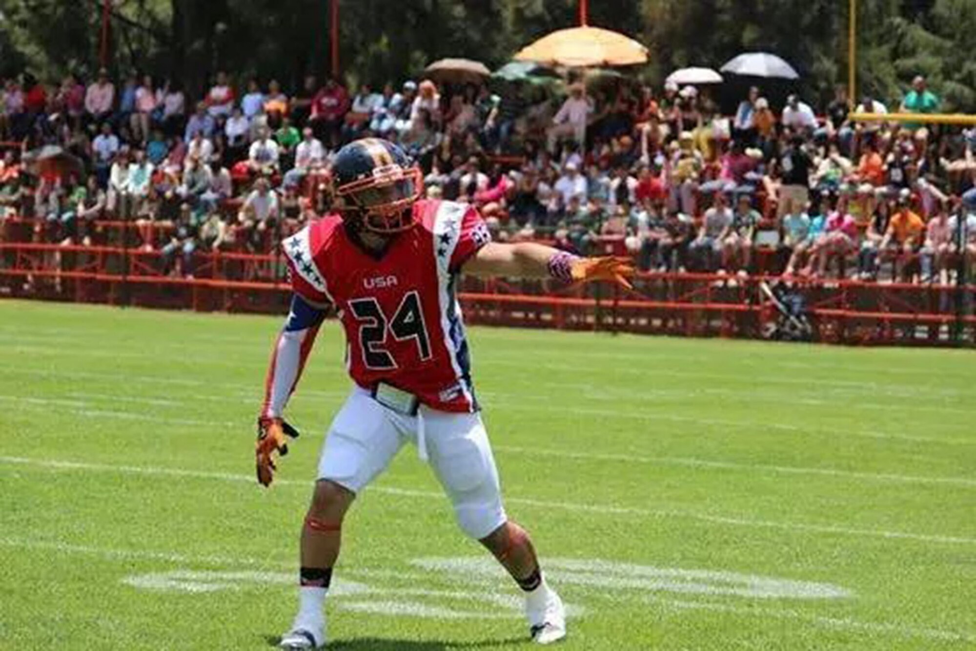 Senior Airman Ian Ramirez, an aeromedical evacuation technician assigned to the 445th Aeromedical Evacuation Squadron, gets ready to catch a pass during a game between the USA Patriots and Costa Rica Bulldogs May 2, 2015. (Courtesy photo)