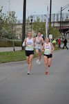Air Force Airman 1st Class Emily Shertzer, a member of the 553rd Band of the Mid-Atlantic in the Pennsylvania National Guard, competes in her first marathon at the National Guard/Lincoln Marathon May 1, 2011. Shertzer won the top spot for National Guard females and second place among overall female runners with a time of 2 hours, 54 minutes, 10 seconds.