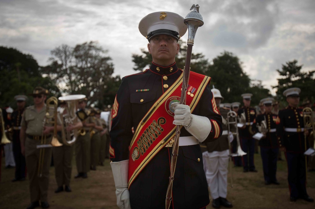 Staff Sgt. Ronald Orange, U.S. Marine Corps Forces, Pacific Band drum major stands in formation before marching in the Coronation Celebration Parade in Nuku'alofa, Tonga, July 4, 2015. The MARFORPAC Band supported the coronation ceremony alongside the New Zealand Army Band, Australian Army Band and Tonga's Royal Corps of Musicians. 