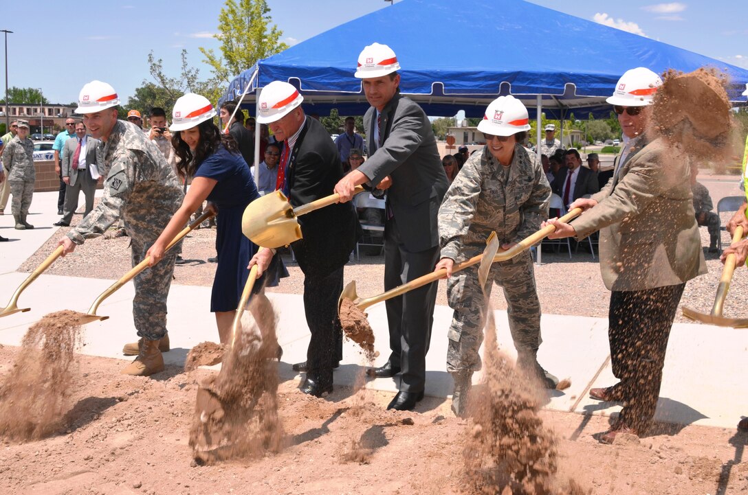 KIRTLAND AIR FORCE BASE, N.M. – District Commander Lt. Col. Patrick Dagon, far left, joins Sen. Martin Heinrich (4th from left) and Maj. Gen. Sandra Finan, commander of the Air Force Nuclear Weapons Center, to ceremonially break ground on Phase 2 of the Air Force Nuclear Weapons Center expansion, June 29, 2015.  