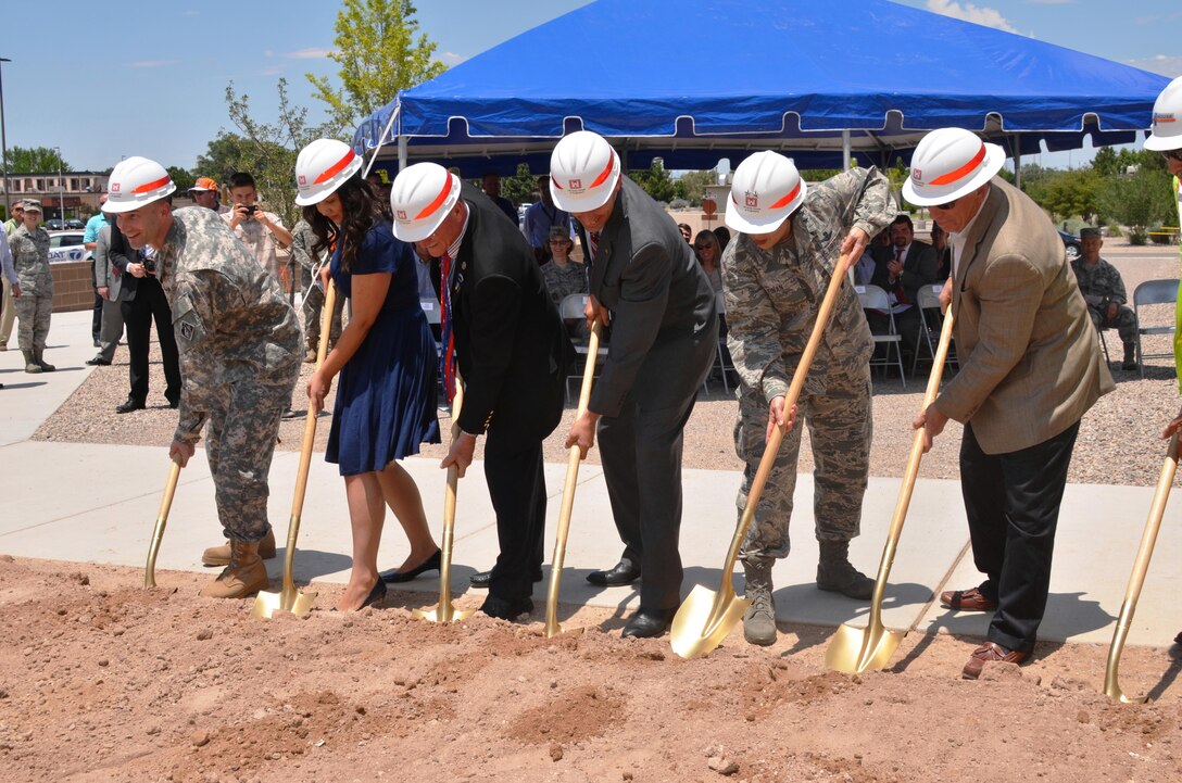 KIRTLAND AIR FORCE BASE, N.M. – District Commander Lt. Col. Patrick Dagon, far left, joins Sen. Martin Heinrich (4th from left) and Maj. Gen. Sandra Finan, commander of the Air Force Nuclear Weapons Center, to ceremonially break ground on Phase 2 of the Air Force Nuclear Weapons Center expansion, June 29, 2015.  
