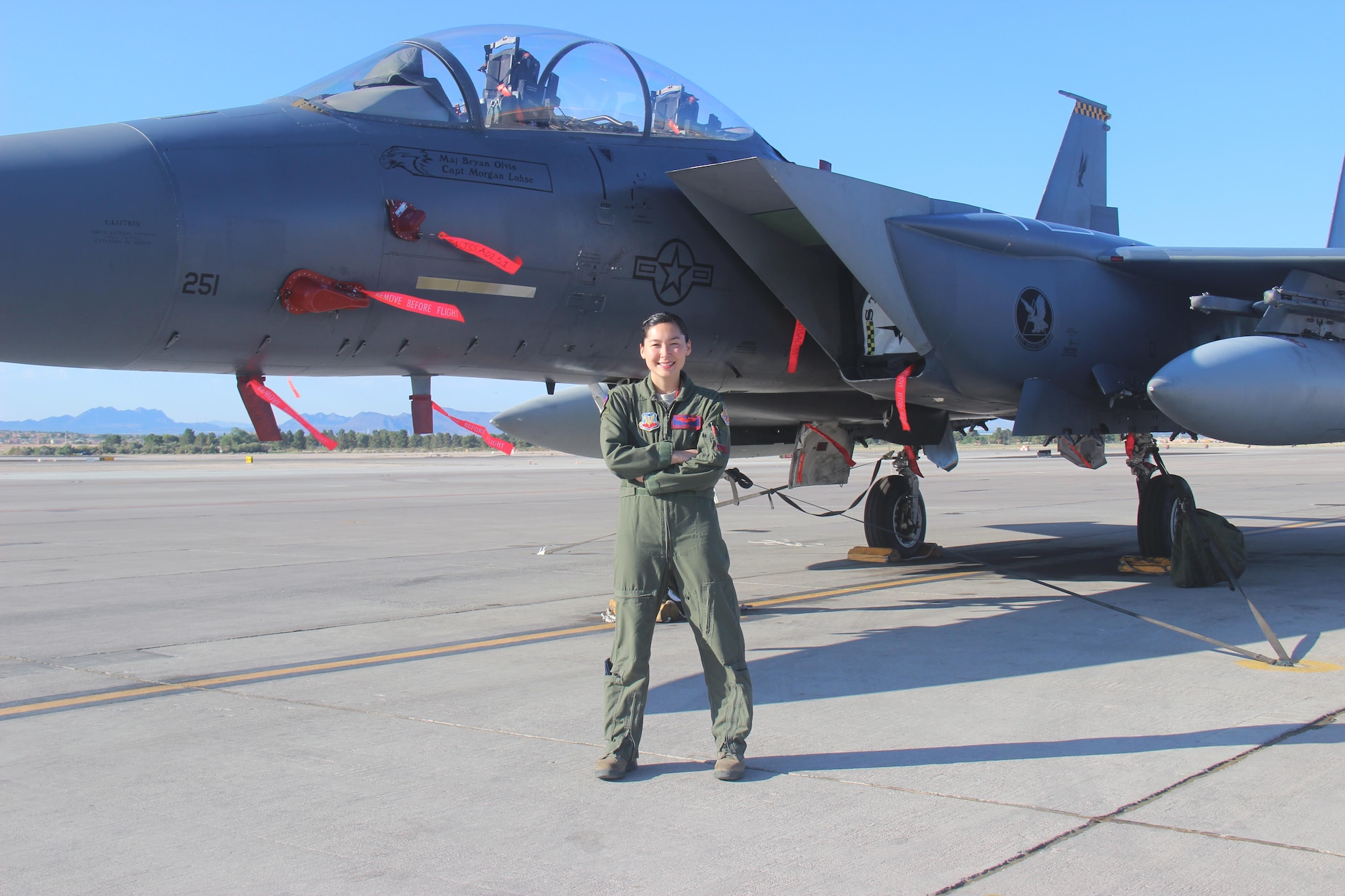Capt. Kari Armstrong, an F-15E Strike Eagle weapon systems officer with the 389th Fighter Squadron, received more than a diploma from the U.S. Air Force Weapons School at Nellis Air Force Base, Nevada, June 27, 2015. Armstrong also became the first female F-15E weapons school officer and the second female student in a fighter platform -- after Col. Jeannie Leavitt in June 1998 -- to complete the graduate-level school. (Courtesy photo/Susan Garcia)