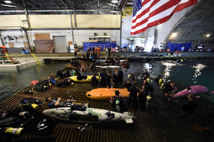 150624-N-PO203-128 
BETHESDA, Md. (June 24, 2015) Competitors prepare their submarines during the 13th International Human-Powered Submarine Race (ISR) being held in the David Taylor Model Basin at the Naval Surface Warfare Center Carderock Division. The mission of the ISR is inspire students of various engineering disciplines to explore broad areas of underwater technology advancement, foster advances in subsea vehicle hydrodynamic, propulsion and life support systems and to increase the public awareness of the challenges people face in working in the and exploring the ocean depths. (U.S. Navy photo by John F. Williams/Released)        