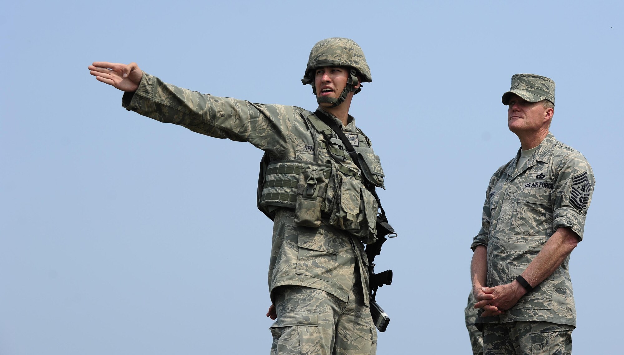 U.S. Air Force Senior Airman Edward Spalione, 8th Security Forces Squadron response force leader, gives a security forces brief to Chief Master Sgt. of the Air Force James A. Cody at Kunsan Air Base, Republic of Korea, July 2, 2015. Cody engaged with Wolf Pack Airmen to answer questions and give insight on key Air Force topics and changes. (U.S. Air Force photo by Staff Sgt. Nick Wilson/Released)