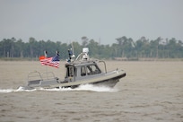 140812-N-PO203-560 NEWPORT NEWS, Va. (Aug. 12, 2014) An unmanned 27-foot harbor security boat from Naval Surface Warfare Center Carderock operates autonomously during an Office of Naval Research-sponsored demonstration of swarmboat technology on the James River in Newport News, Va. During the demonstration as many as 13 Navy boats, using an Office of Naval Research-sponsored system called CARACaS (Control Architecture for Robotic Agent Command Sensing), operated autonomously or by remote control during escort, intercept and engage scenarios. (U.S. Navy photo by John F. Williams/Released)