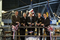 131219-N-XI735-181 BETHESDA, Md. (Dec. 19, 2013) Naval Surface Warfare Center, Carderock Division Naval Architecture & Engineering Department Head, Jon Etxegoien, right, Naval Surface Warfare Center Commander, Rear Adm. Lawrence Creevy, Dr. John Holdren, Assistant to the President for Science and Technology, Director of the White House Office of Science and Technology Policy, and Co-Chair of the President's Council of Advisors on Science and Technology, Naval Surface Warfare Center, Carderock Division, Commander Capt. Richard Blank, and Naval Surface Warfare Center, Carderock Division, Technical Director Dr. Joseph (Tim) Arcano cut a ribbon during the opening of the Maneuvering and Seakeeping (MASK) basin facility at Naval Surface Warfare Center, Carderock Division. (U.S. Navy photo by Devin Pisner/Released) 