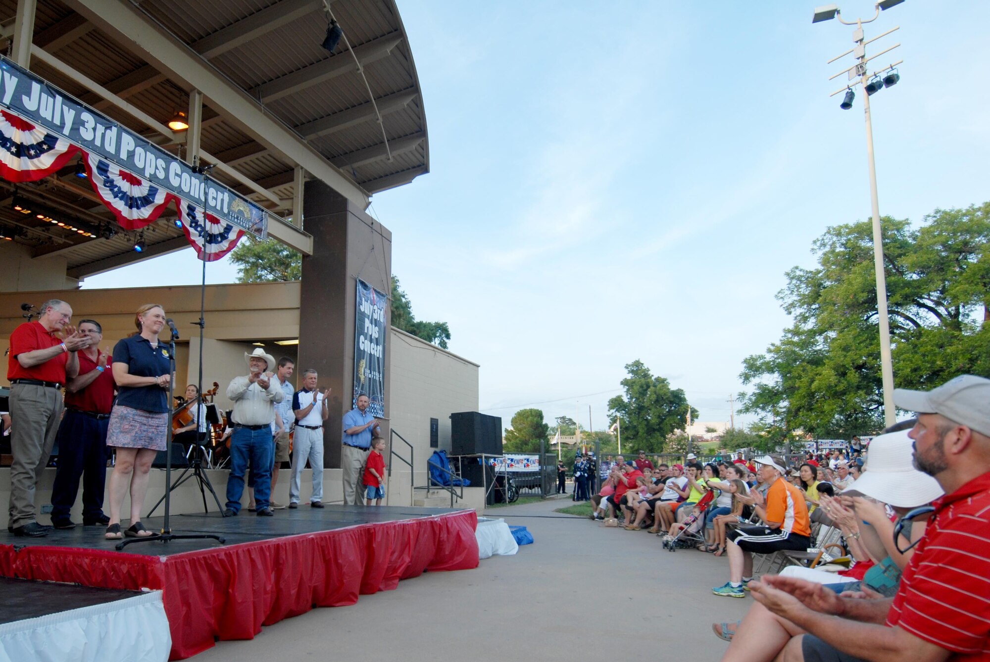 U.S. Air Force Col. Kimberlee P. Joos, 17th Training Wing Commander, speaks during the San Angelo Symphony’s Pops Concert at the Bill Aylor Sr. Memorial RiverStage in San Angelo, Texas, July 3, 2015. Col. Joos spoke about the relationship between San Angelo and Goodfellow, and why Independence Day is important. (U.S. Air Force photo by Senior Airman Joshua Edwards/Released)