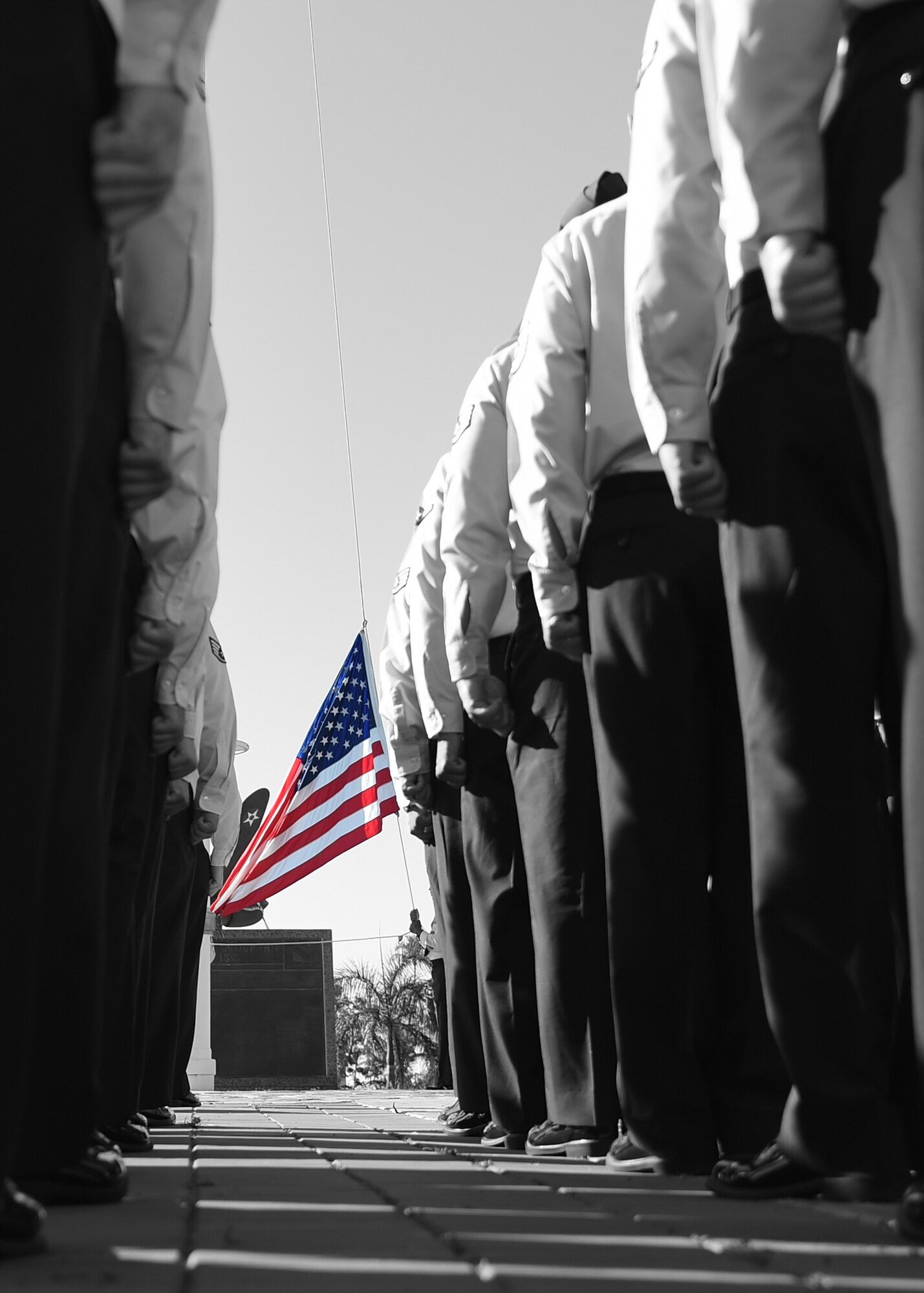 Members of the 747th Communications Squadron stand at attention prior to a Reveille ceremony on Joint Base Pearl Harbor-Hickam, Hawaii, July 2, 2015. The ceremony was held to honor the upcoming Fourth of July holiday. This year, the United States of America celebrates 239 years of independence.  (U.S. Air Force illustration by Tech. Sgt. Aaron Oelrich/Released) 