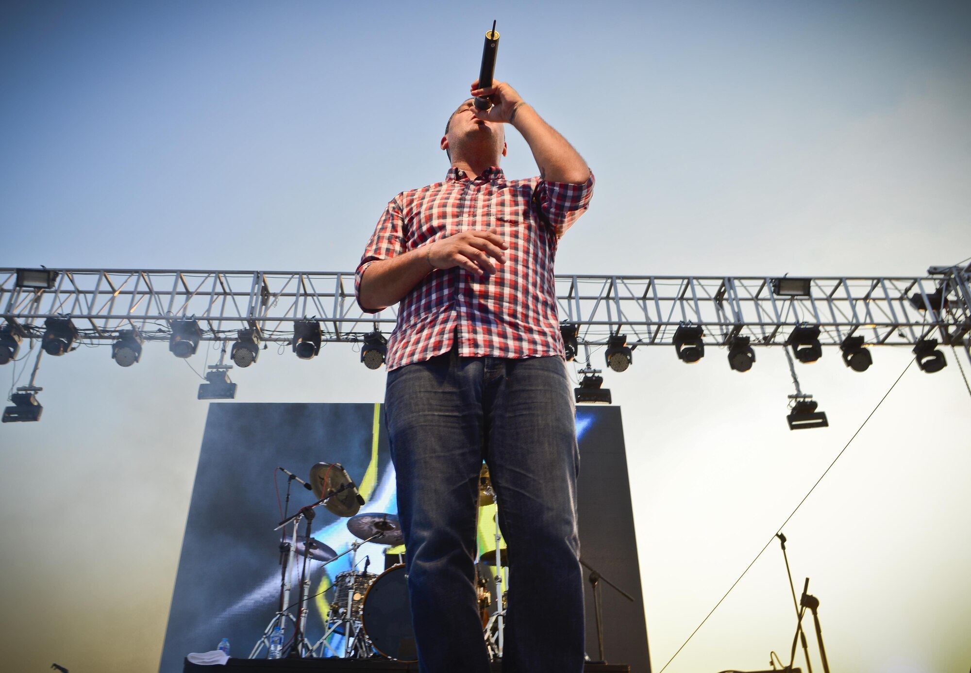 Dryden Mitchell, Alien Ant Farm frontman, sings one of his hit singles, “Attitude,” during an 80-minute concert July 4, 2015 at Osan Air Base, Republic of Korea. Alien Ant Farm was at Osan AB in part of the Liberty Fest entertainment, in celebration of Independence Day. (U.S. Air Force photo/Tech. Sgt. Travis Edwards) 
