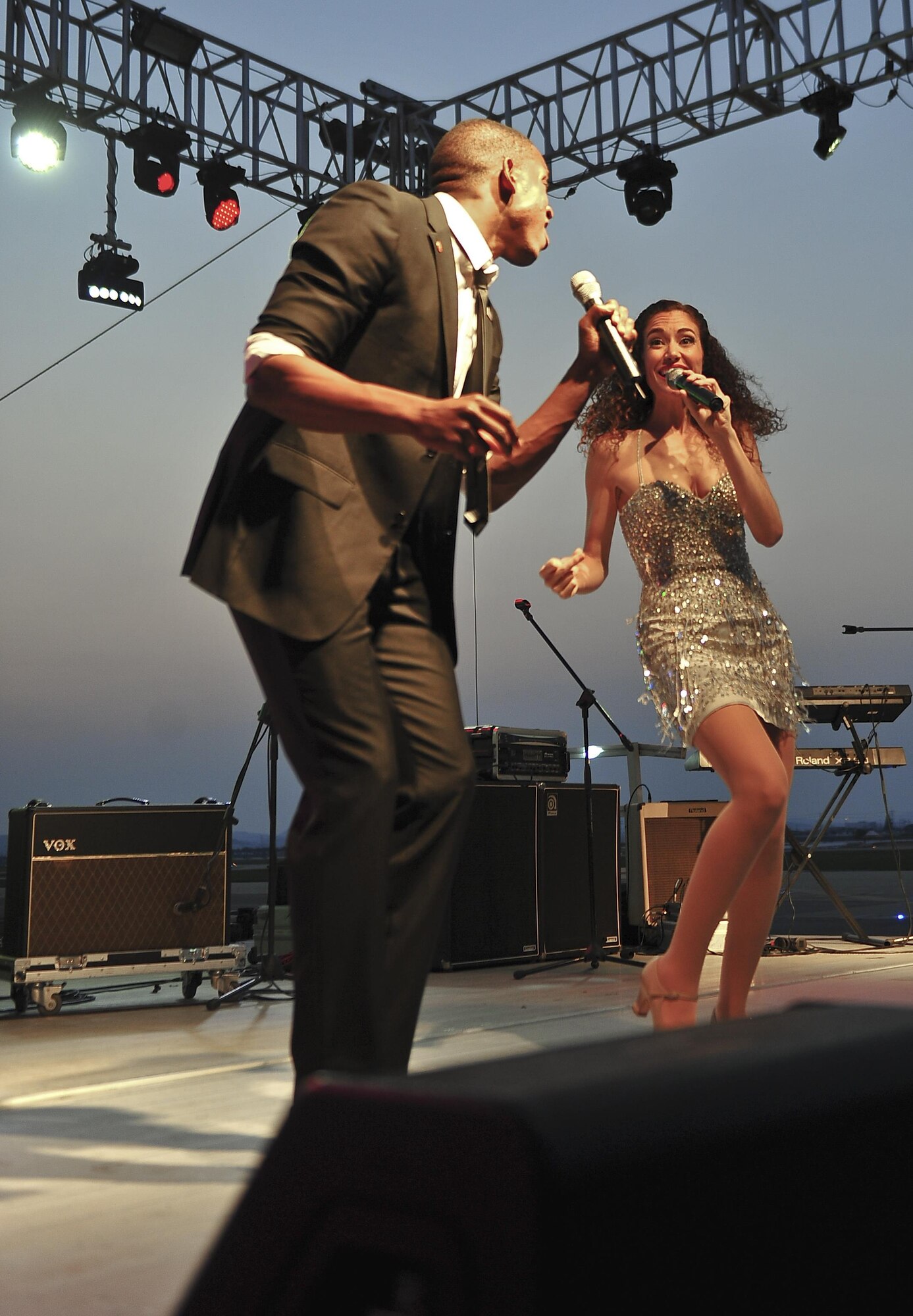 Colby Lewis and Priscilla Fernandez sing top Billboard hit during the Liberty Fest concert July 4, 2015, at Osan Air Base, Republic of Korea. Lewis and Fernandez were part of the USO Show Troupe who sang as part of the entertainment in celebration of Independence Day. (U.S. Air Force photo by Tech. Sgt. Travis Edwards/Released)