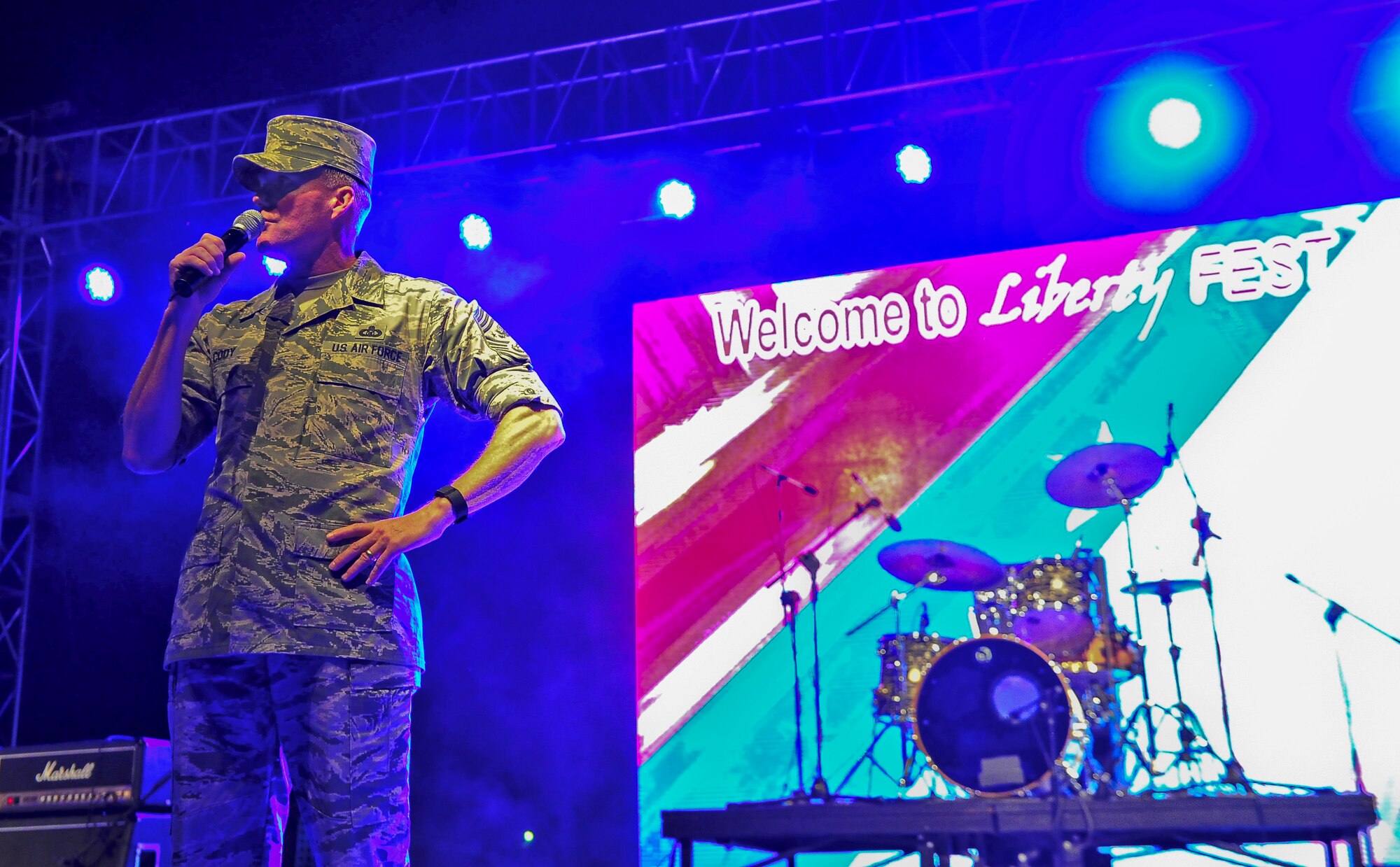 Chief Master Sgt. of the Air Force James Cody addresses a crowd prior to giving the countdown to the fireworks display during the Osan Liberty Fest, July 4, 2015, at Osan Air Base, Republic of Korea. Cody had just finished a muti-day tour of the ROK to gather an accurate sight picture of what Airmen do to defend liberty for the 51 million citizens who make up the country. (U.S. Air Force photo by Tech. Sgt. Travis Edwards/Released) 
