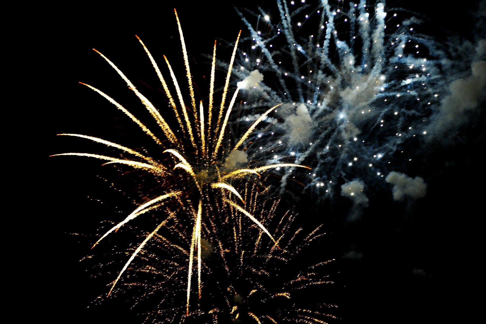 Fireworks ignite the sky over Osan Air Base, Republic of Korea, July 4, 2015, in celebration of Independence Day. The fireworks presentation was one of the last displays of entertainment for a crowd of more than 5,000 during the festival. (U.S. Air Force photo by Tech. Sgt. Travis Edwards/Released)