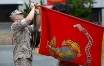 Lt. Col. Christian M. Rankin, commanding officer, 1st Light Armored Reconnaissance Battalion, places a battle streamer on the battalion’s organizational colors during the 30th anniversary rededication ceremony aboard Marine Corps Base Camp Pendleton, Calif., July 1, 2015. After the ceremony, the Marines and Sailors of the battalion hiked to a nearby beach and held the annual Highlander Games Warrior Night. (U.S. Marine Corps photo by Staff Sgt. Bobbie A. Curtis)